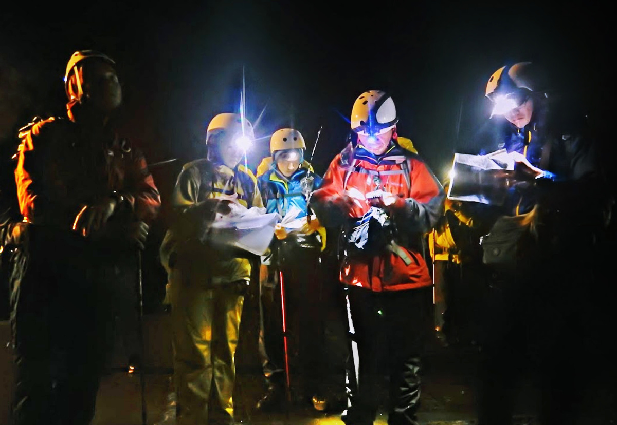 Rescue team checking a map